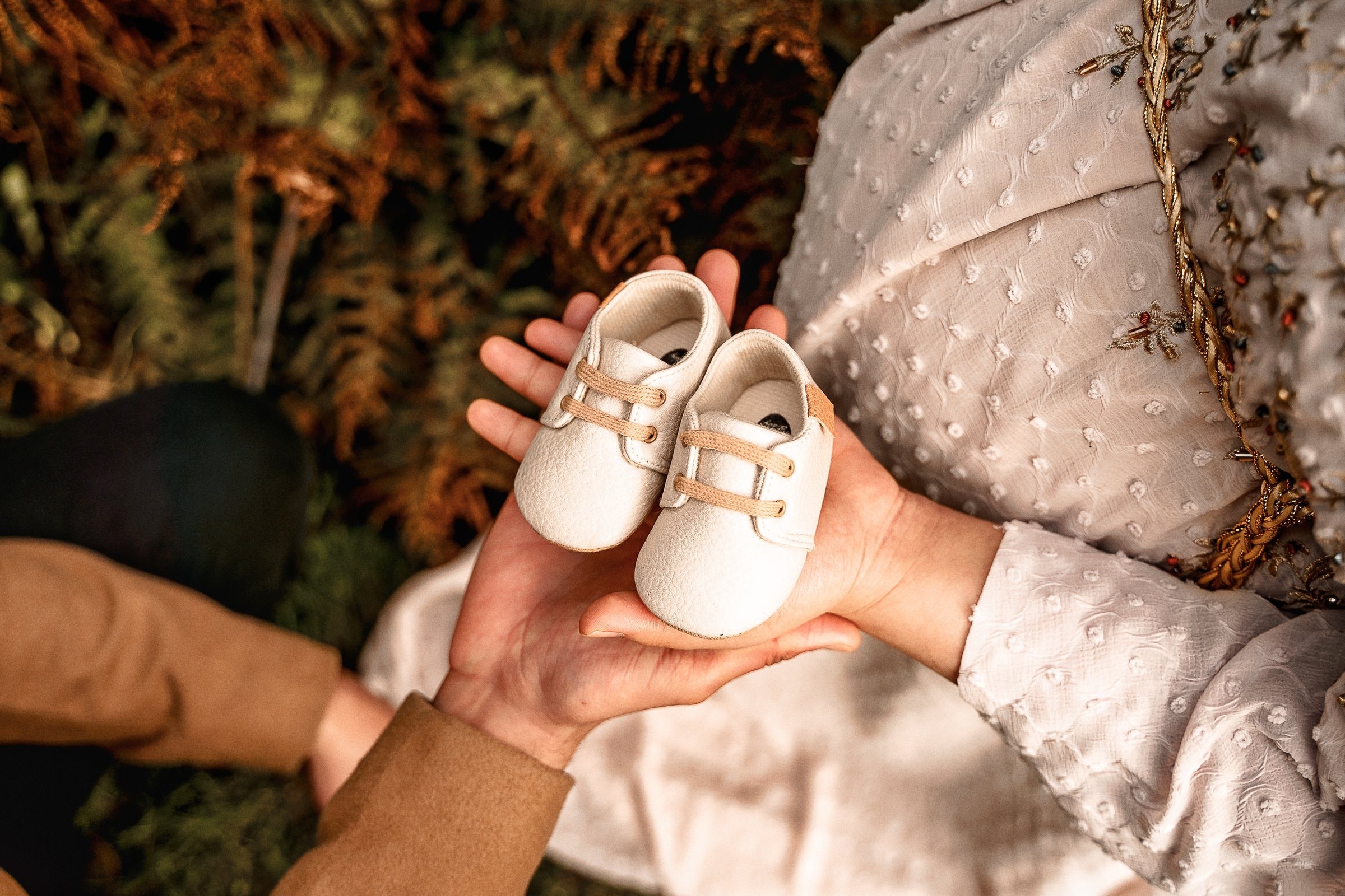 A quiet embroidered maternity portrait