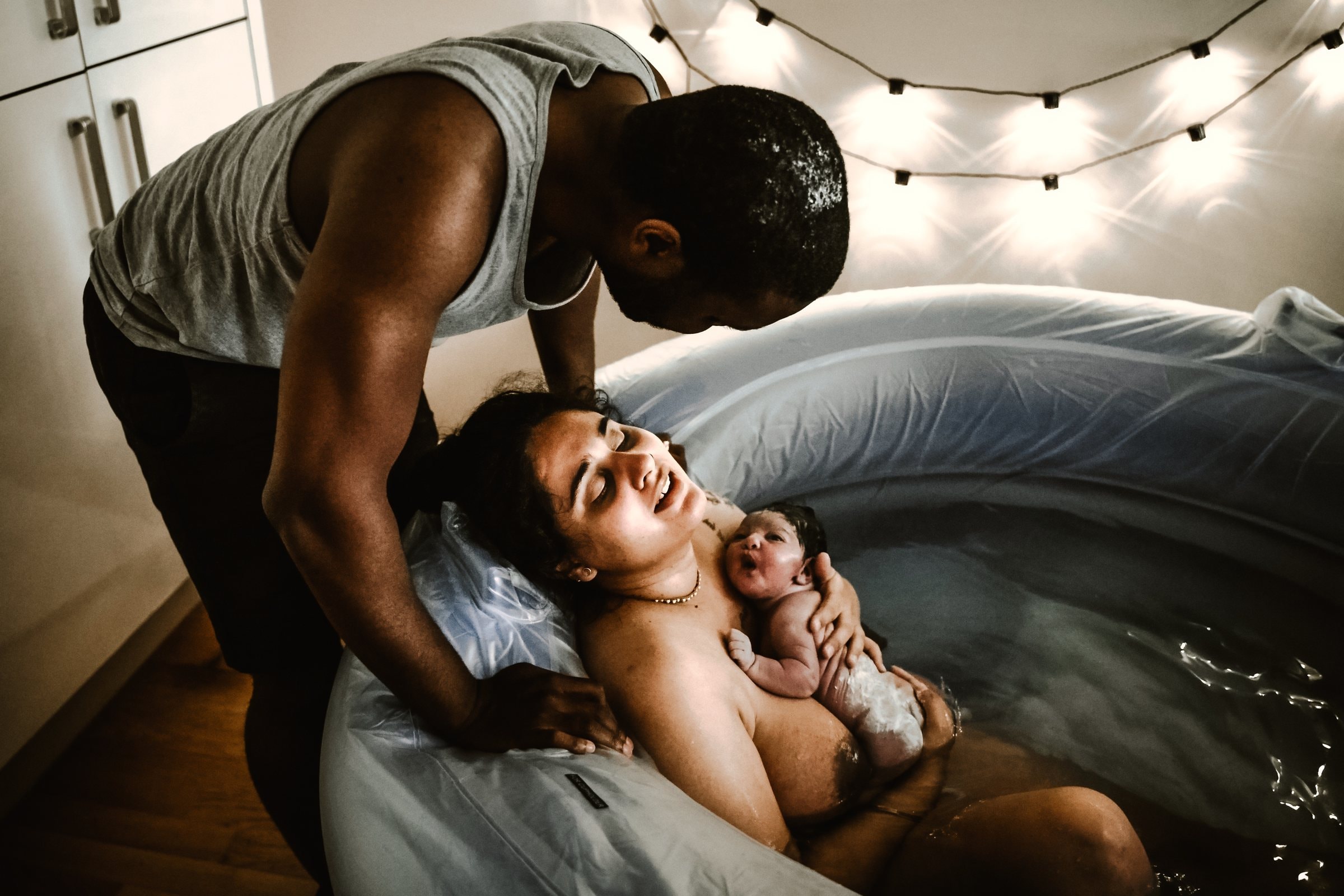 Misty resting with her parents in the birth pool