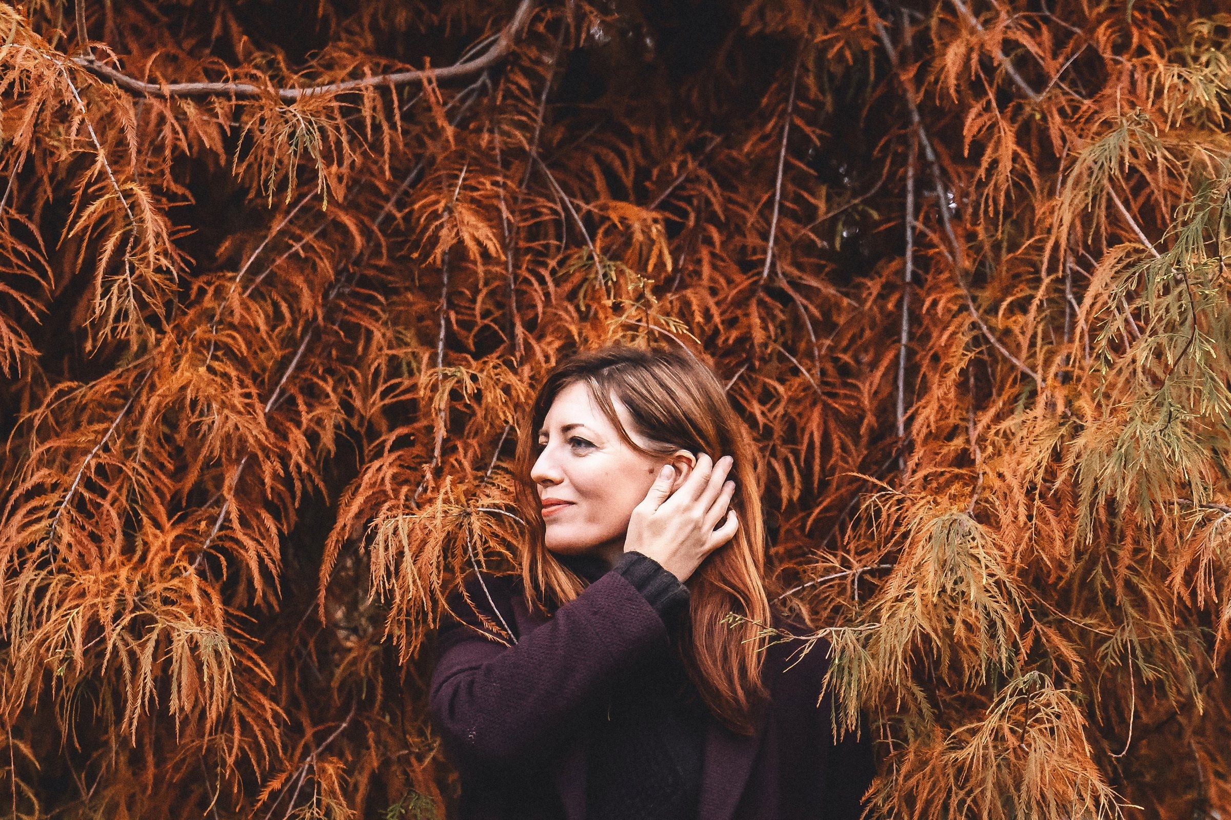Sandra resting among autumn leaves
