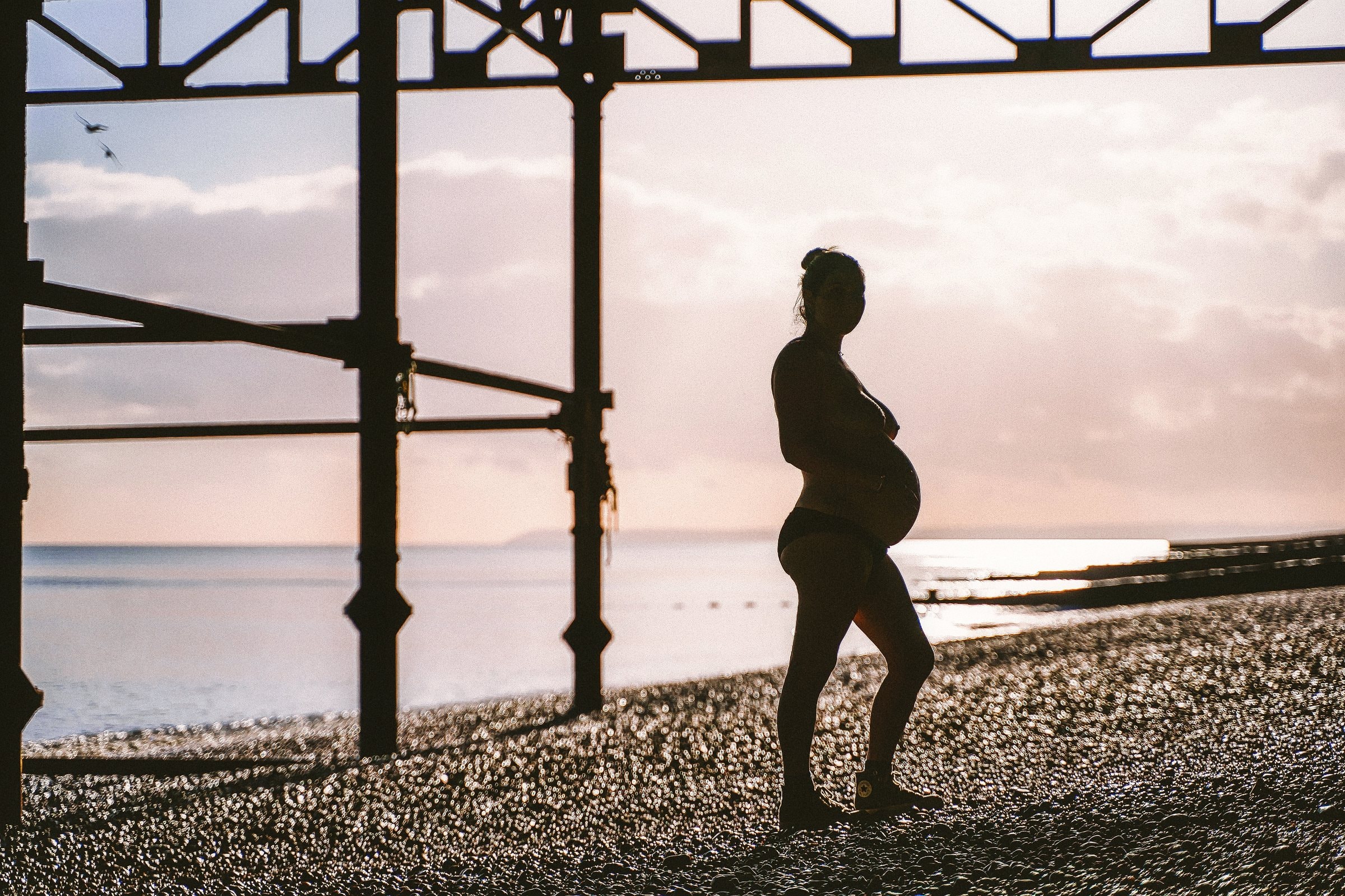 Solene silhouetted against the pale evening horizon
