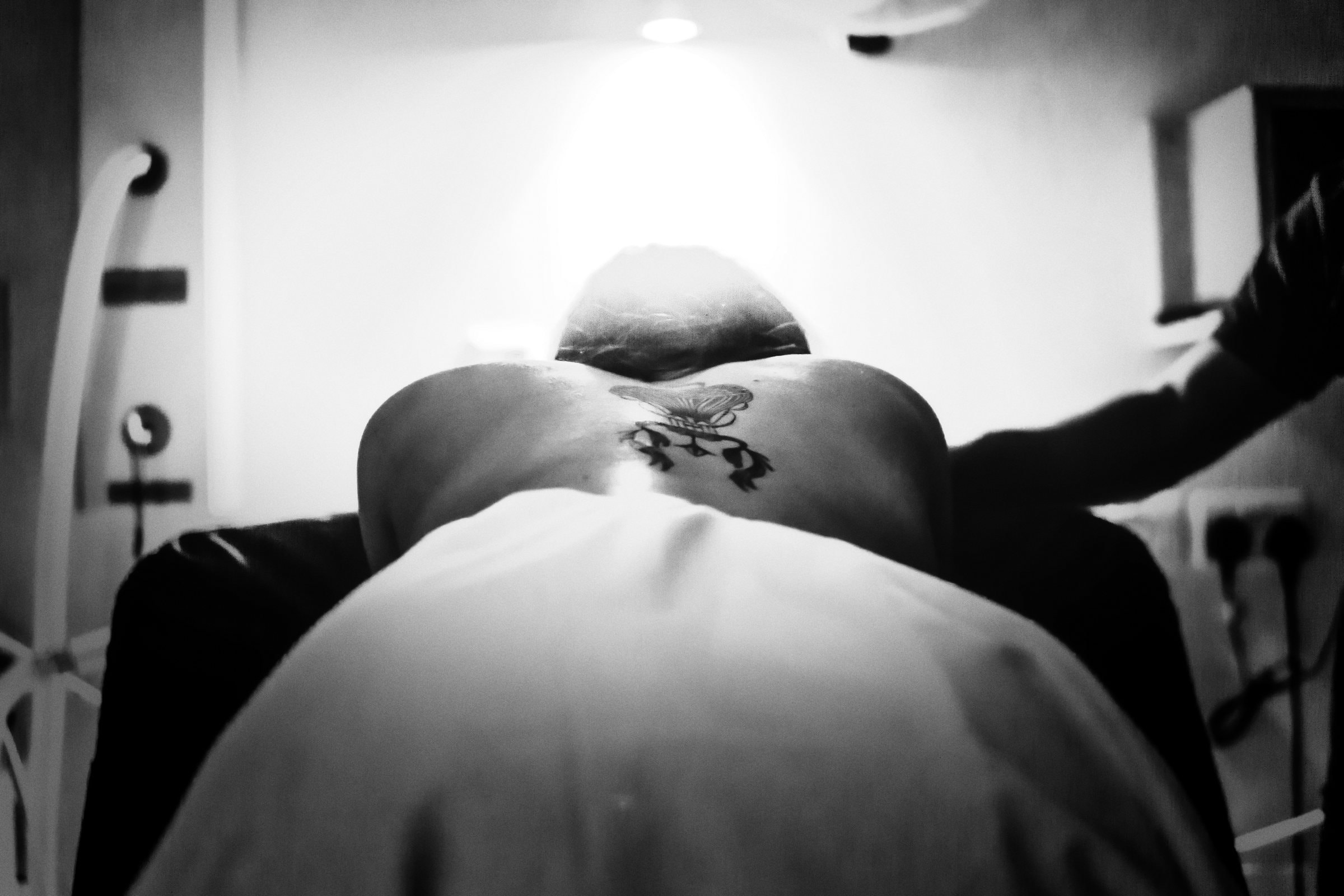 Teresa’s body held in a powerful monochrome birth portrait