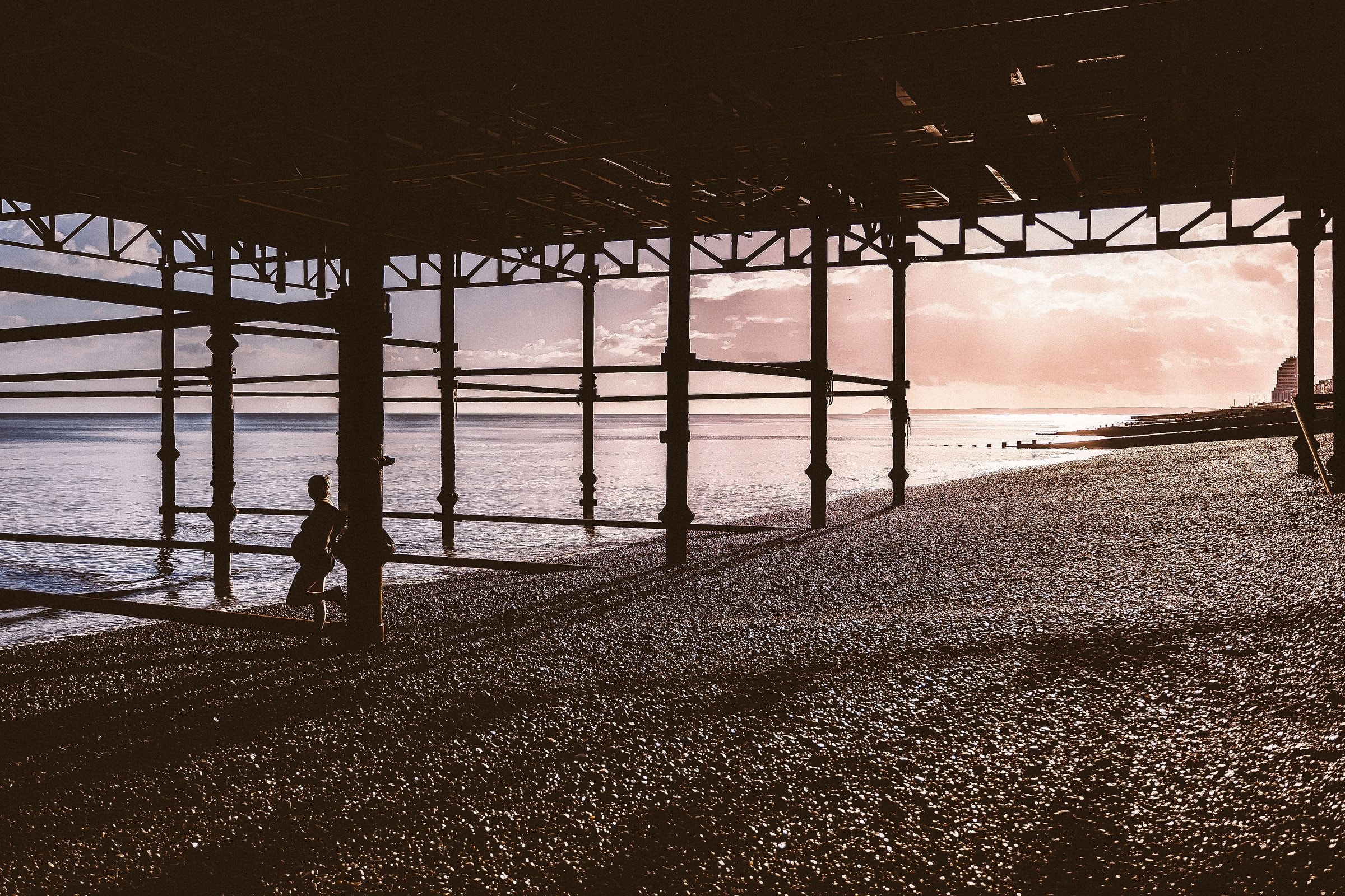Solene standing alone in the wide architecture of the pier
