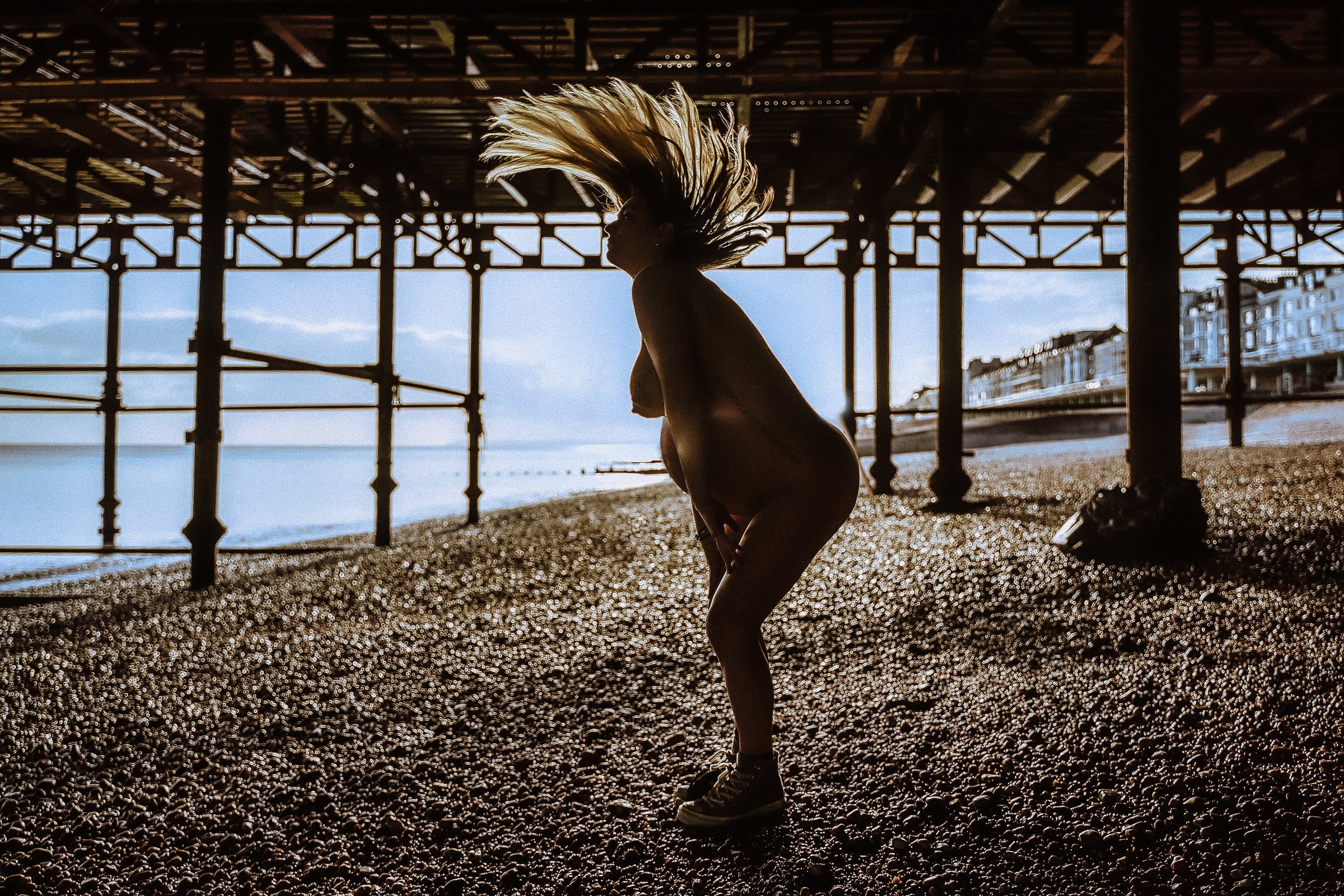 Solene moving freely beneath the ironwork of the seaside pier