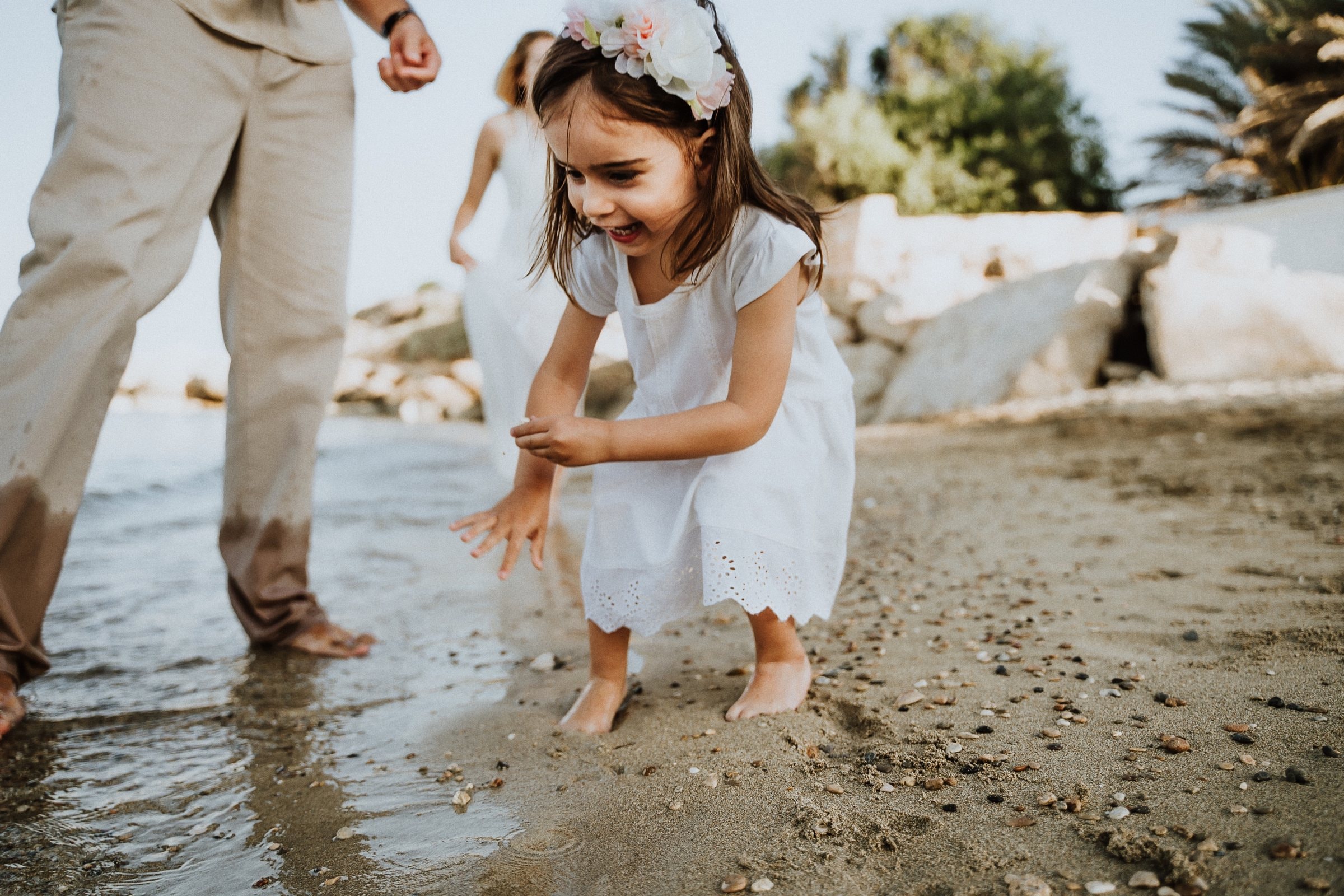 A child running barefoot along the Cyprus shore
