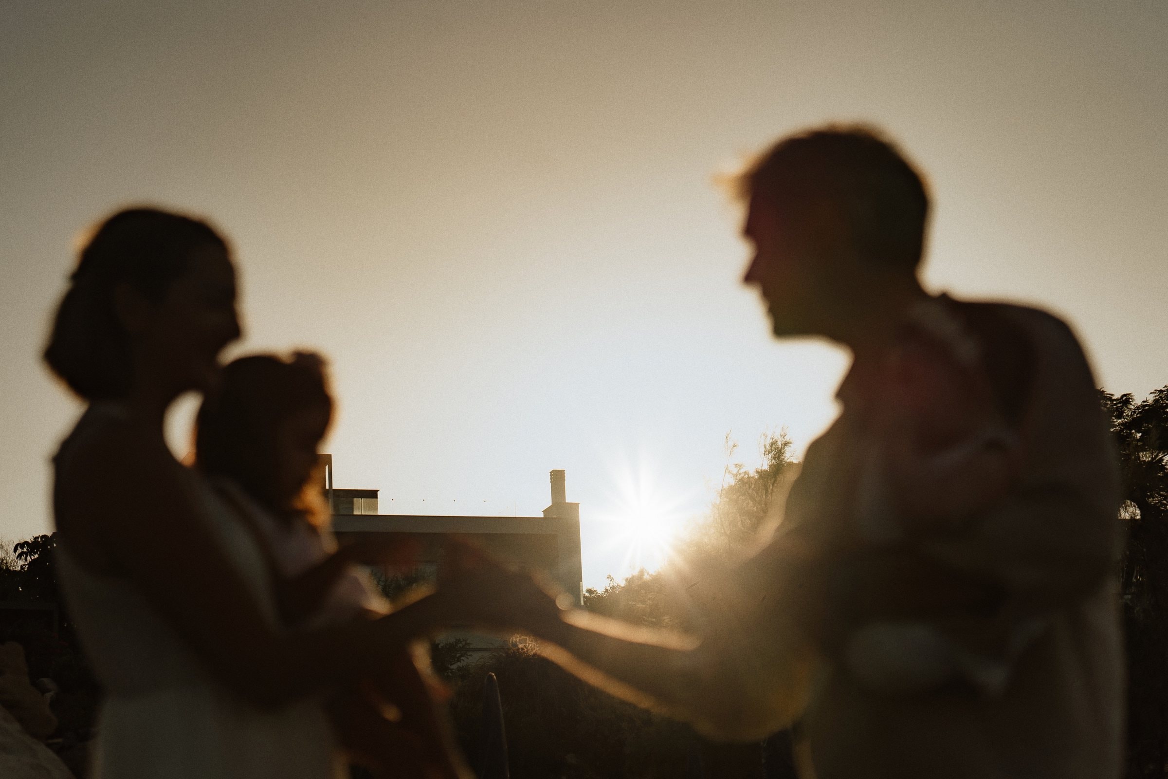 A quiet silhouette of the family at sunset