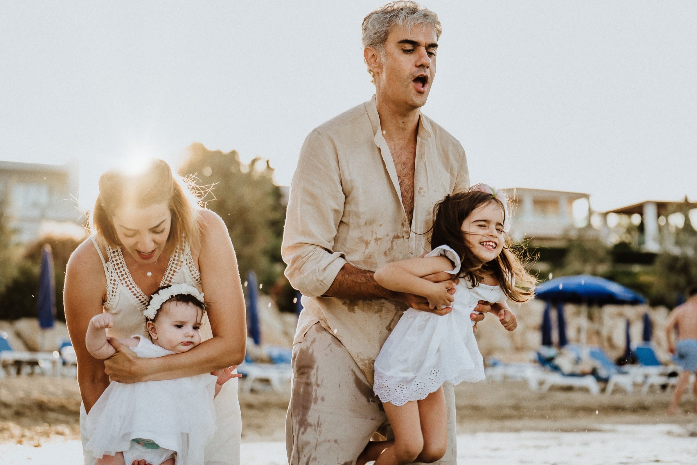Tasha and her family walking from the sea in warm evening light