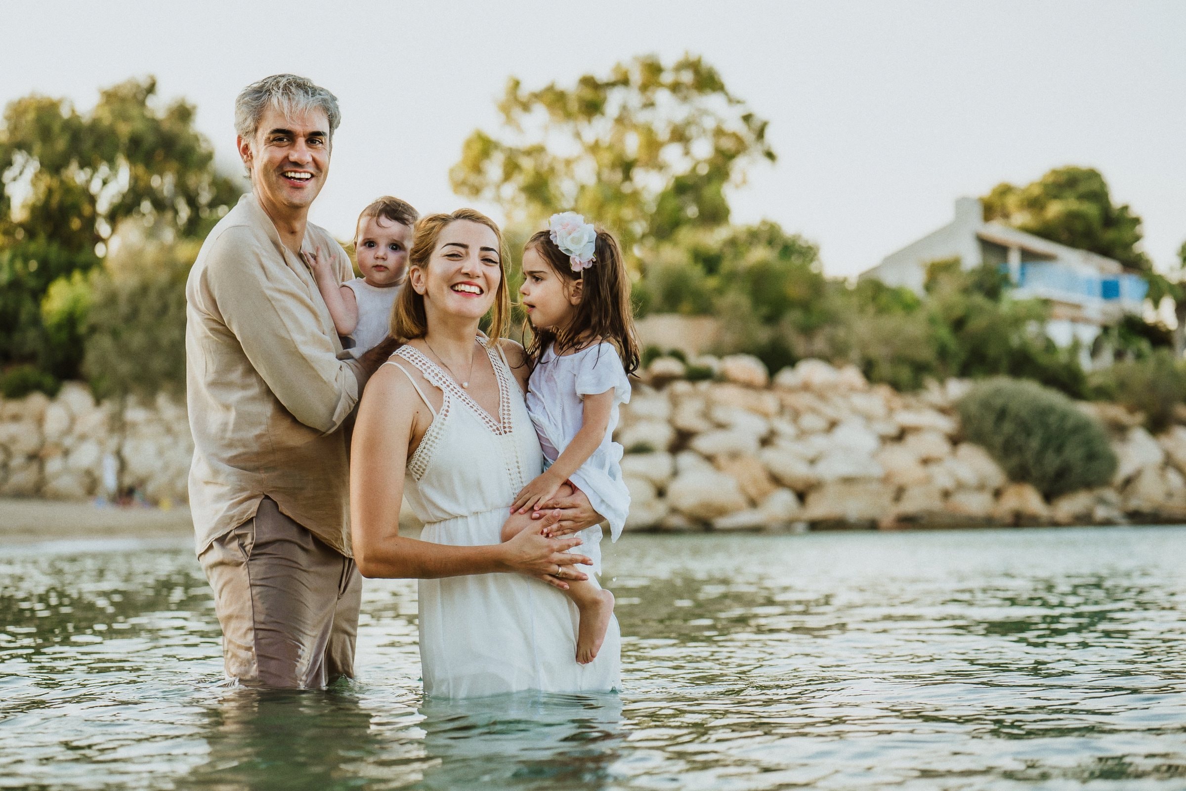 Tasha and her family gathered in calm sunlit water