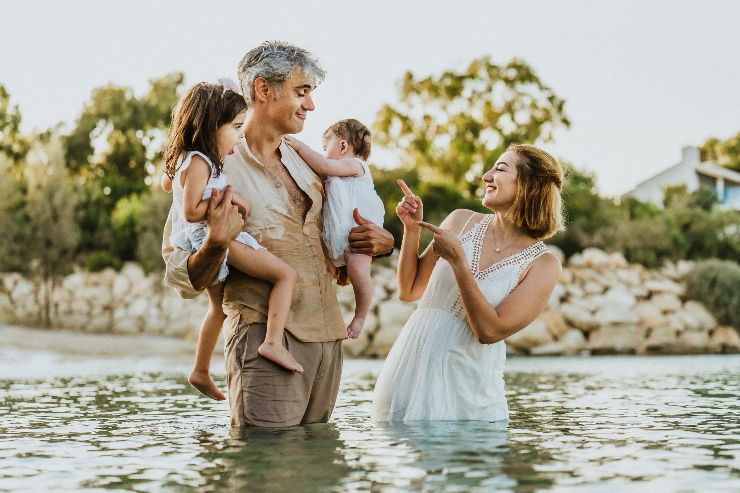 The family talking and laughing together in the sea